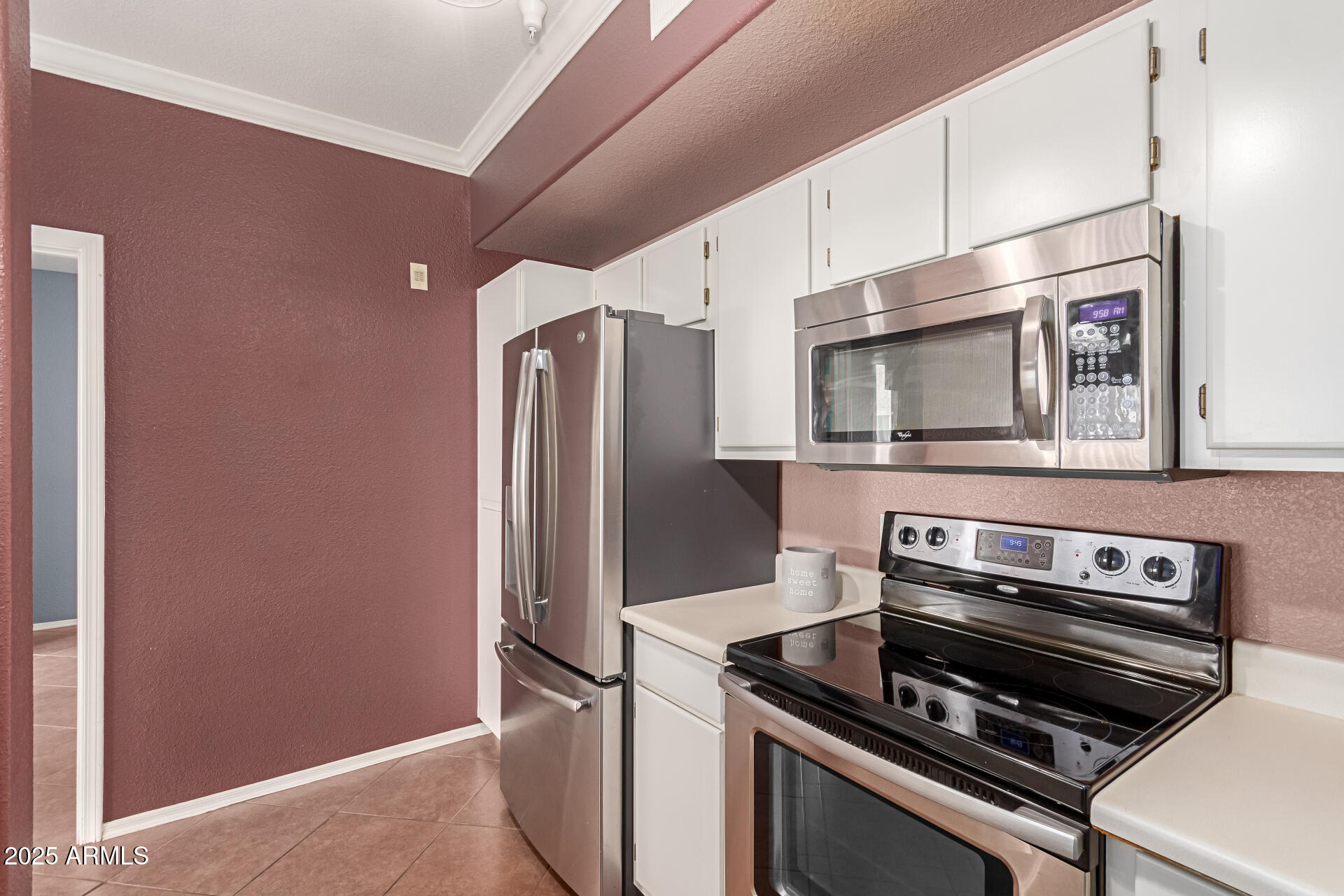 3236 East Chandler Boulevard, Unit 1082 Phoenix, AZ 85048 - Photo 16 of 28 a kitchen with a refrigerator stove and microwave