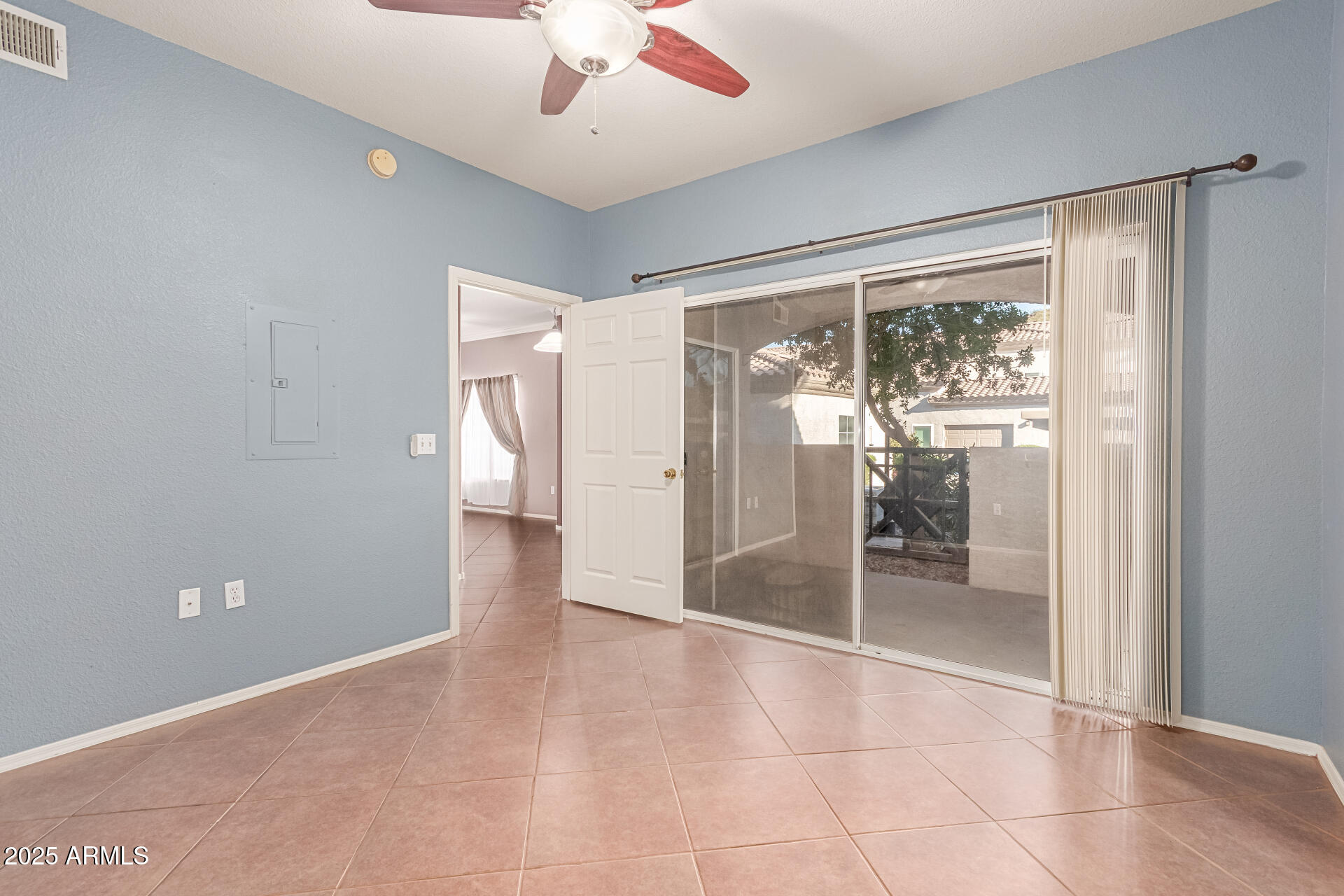 3236 East Chandler Boulevard, Unit 1082 Phoenix, AZ 85048 - Photo 19 of 28 en empty room with sliding door and balcony view