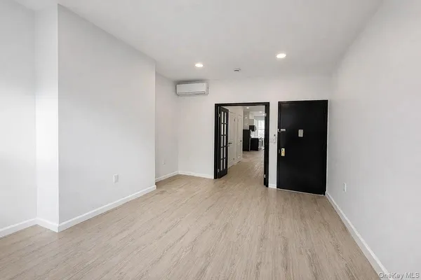 a view of hallway with wooden floor