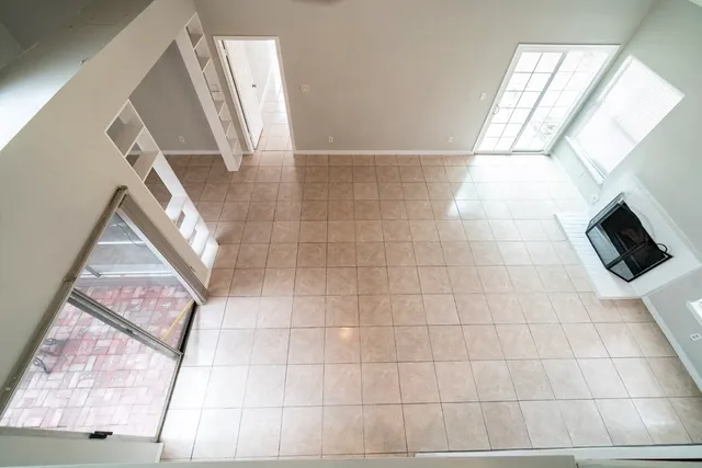 a bathroom with a bathtub and a window