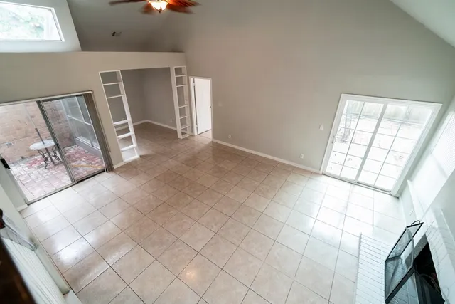 a view of an empty room with windows