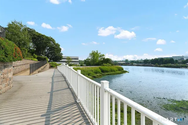 a living room with furniture and a clock