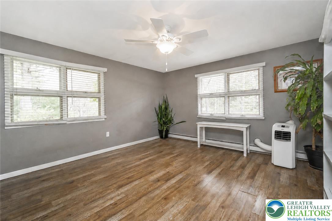 135 Haney Road Kunkletown, PA 18058 - Photo 20 of 53 an empty room with windows and ceiling fan