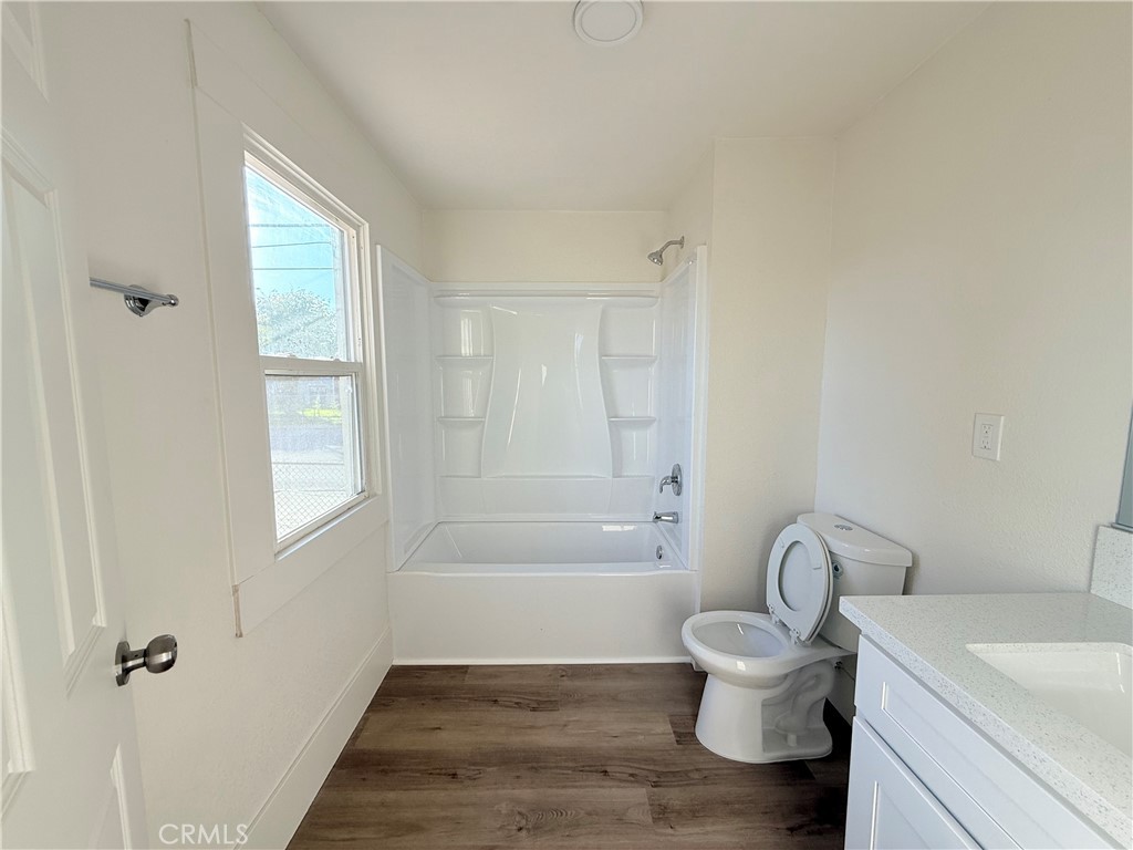 392 West L Street Colton, CA 92324 - Photo 24 of 41 a bathroom with a sink toilet and shower