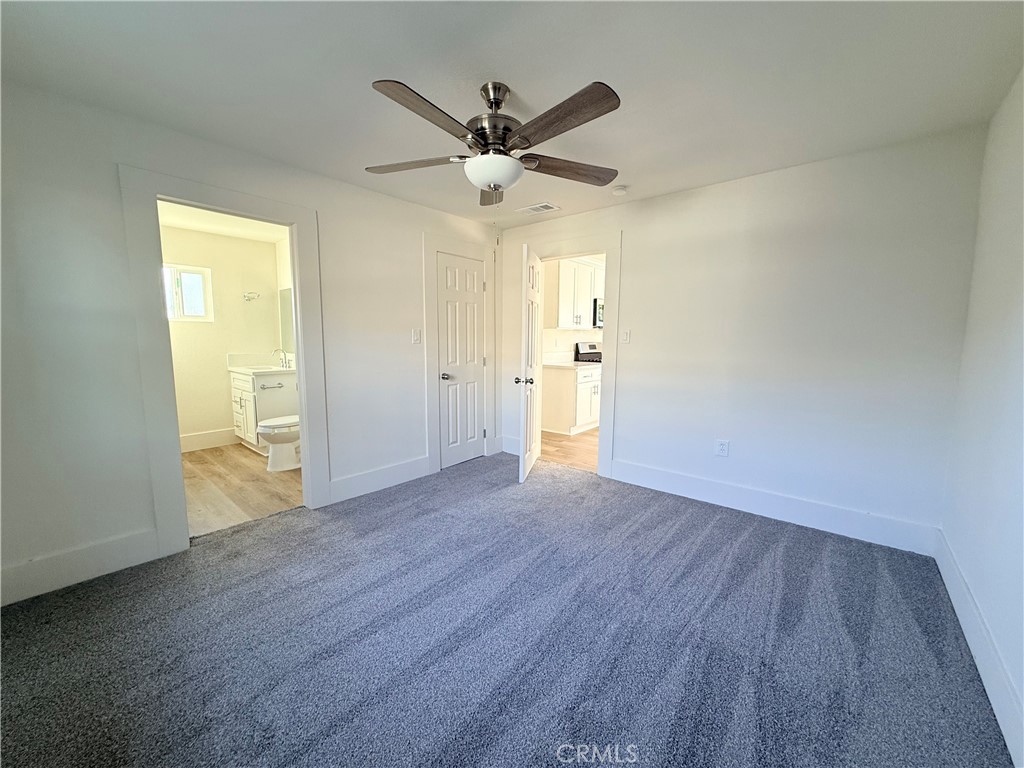 392 West L Street Colton, CA 92324 - Photo 25 of 41 a view of an empty room with wooden floor and a window