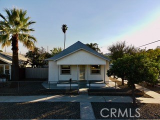 392 West L Street Colton, CA 92324 - Photo 5 of 41 a front view of a house with garden