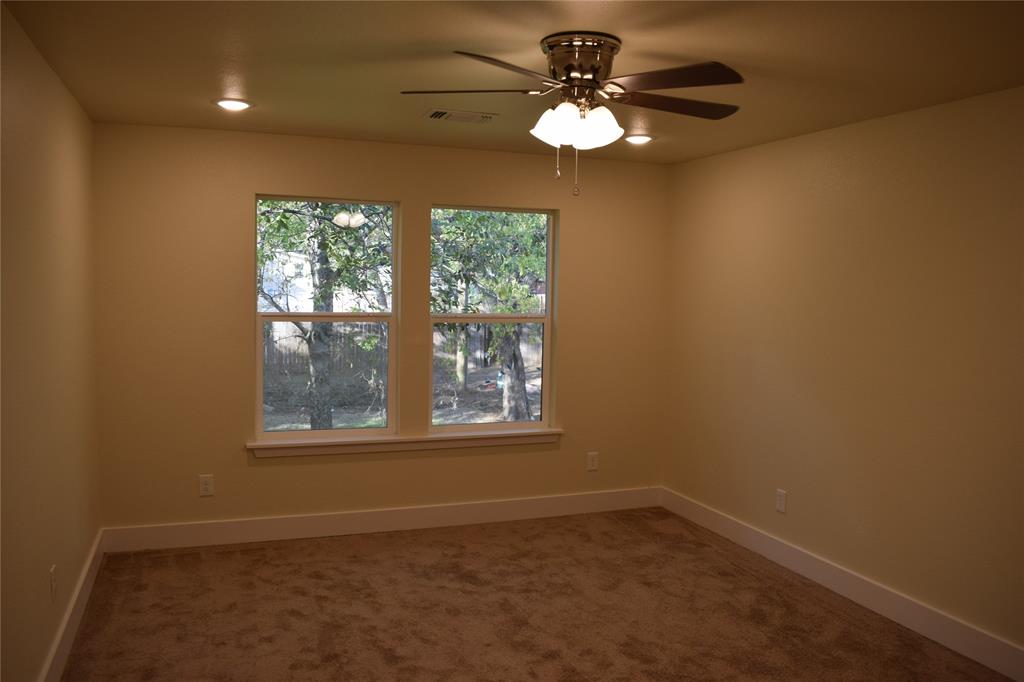 621 East Murray Street Denison, TX 75021 - Photo 20 of 31 an empty room with a window