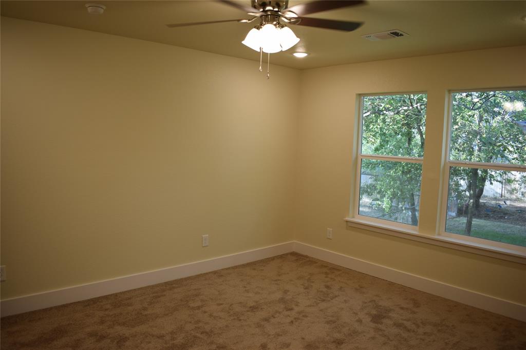 621 East Murray Street Denison, TX 75021 - Photo 21 of 31 an empty room with a window
