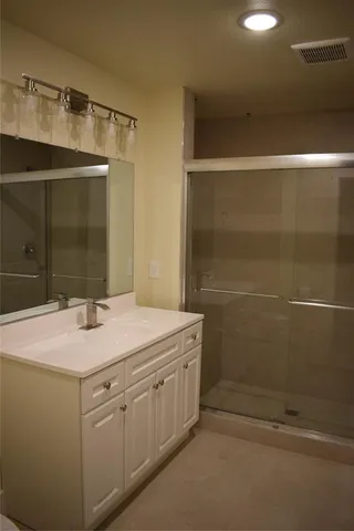 a bathroom with a sink and mirror