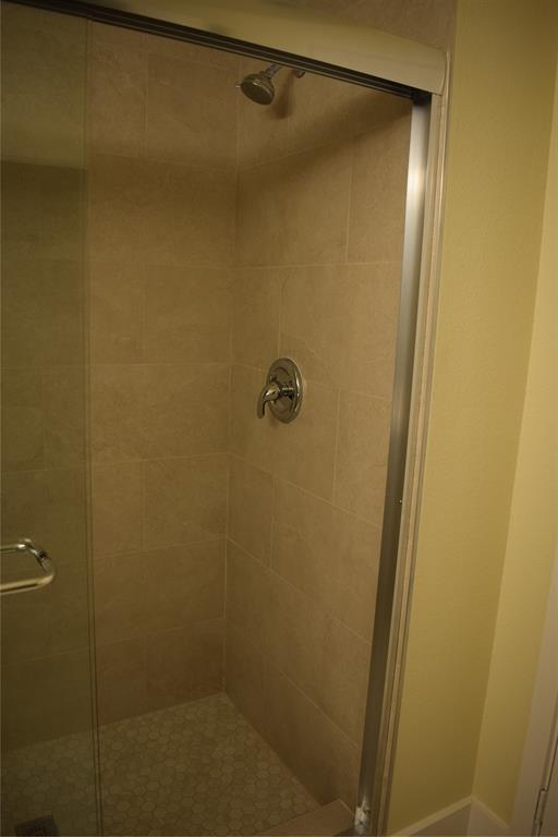 621 East Murray Street Denison, TX 75021 - Photo 26 of 31 a bathroom with a shower