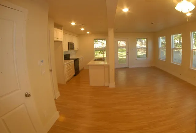 a view of an empty room with a window