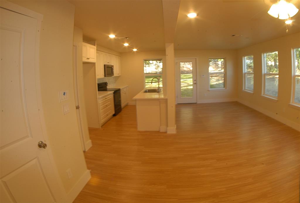621 East Murray Street Denison, TX 75021 - Photo 4 of 31 a view of an empty room with a window