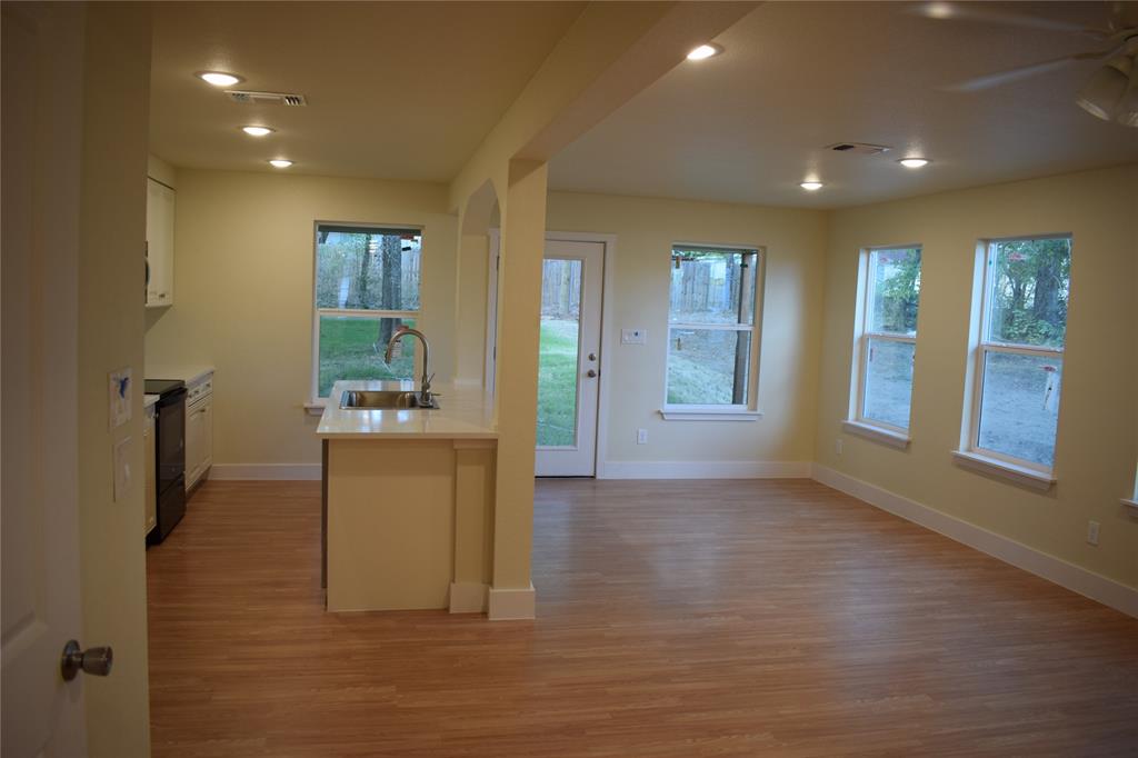 621 East Murray Street Denison, TX 75021 - Photo 9 of 31 a view of livingroom with hardwood floor
