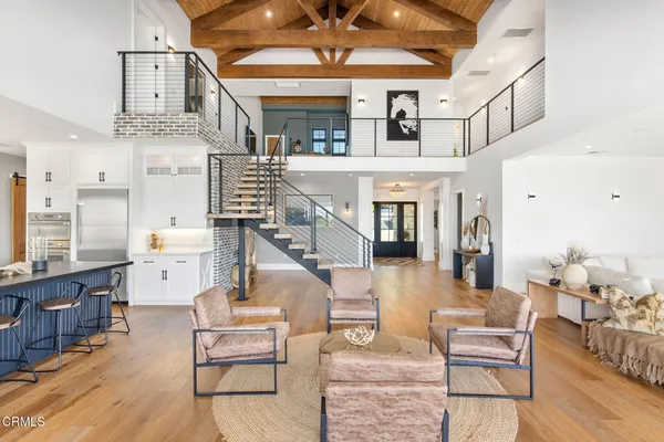 a kitchen and a dining room with furniture