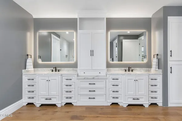a view of a living room with a large window and furniture
