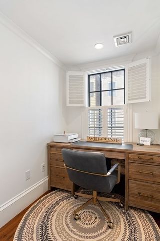 a room that has a dresser and a chair in it