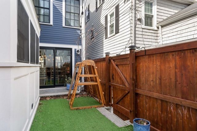 a view of a house with backyard and porch