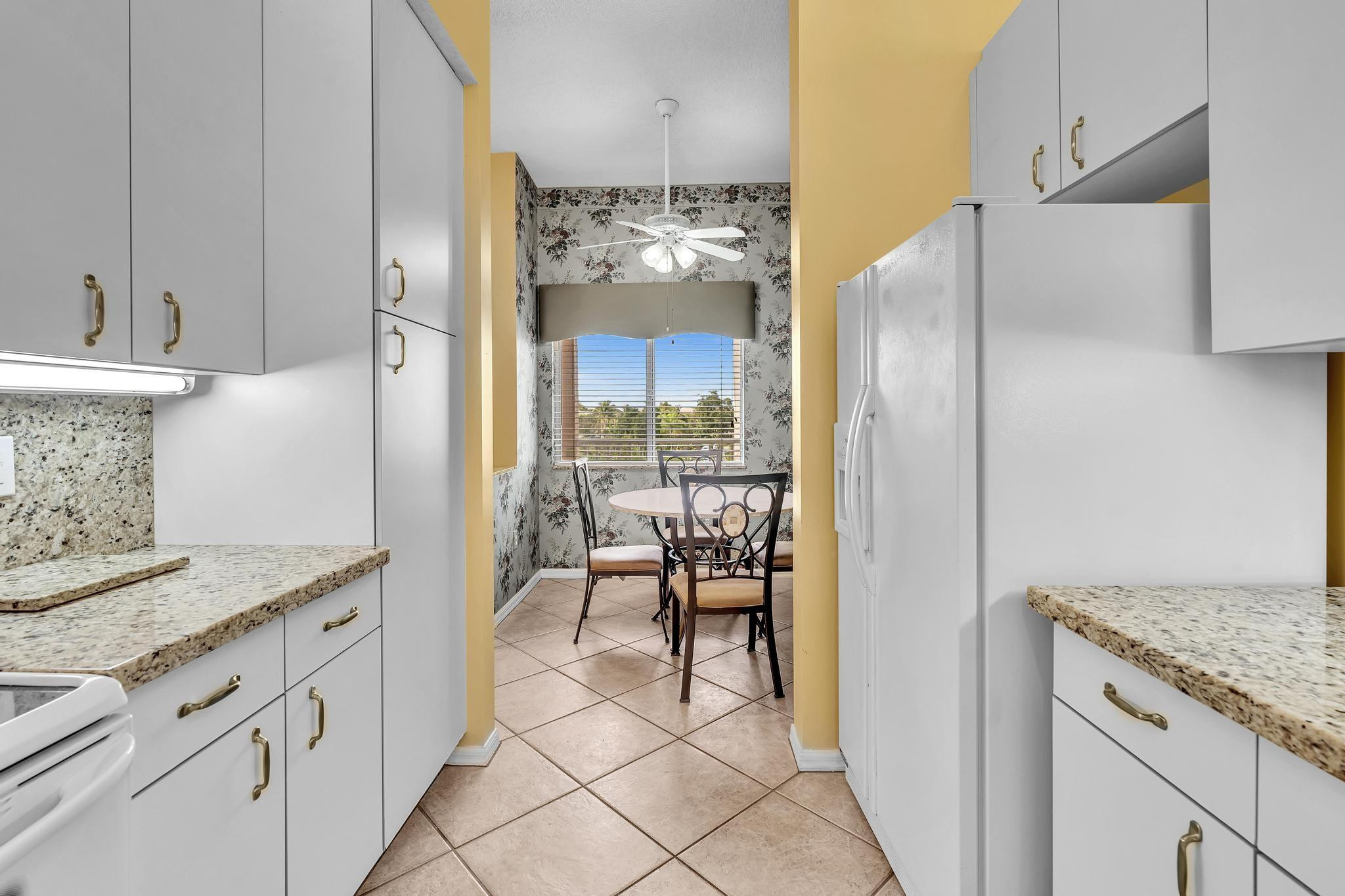 9551 Weldon Circle, Unit E411 Tamarac, FL 33321 - Photo 11 of 78 a view of a kitchen from the kitchen