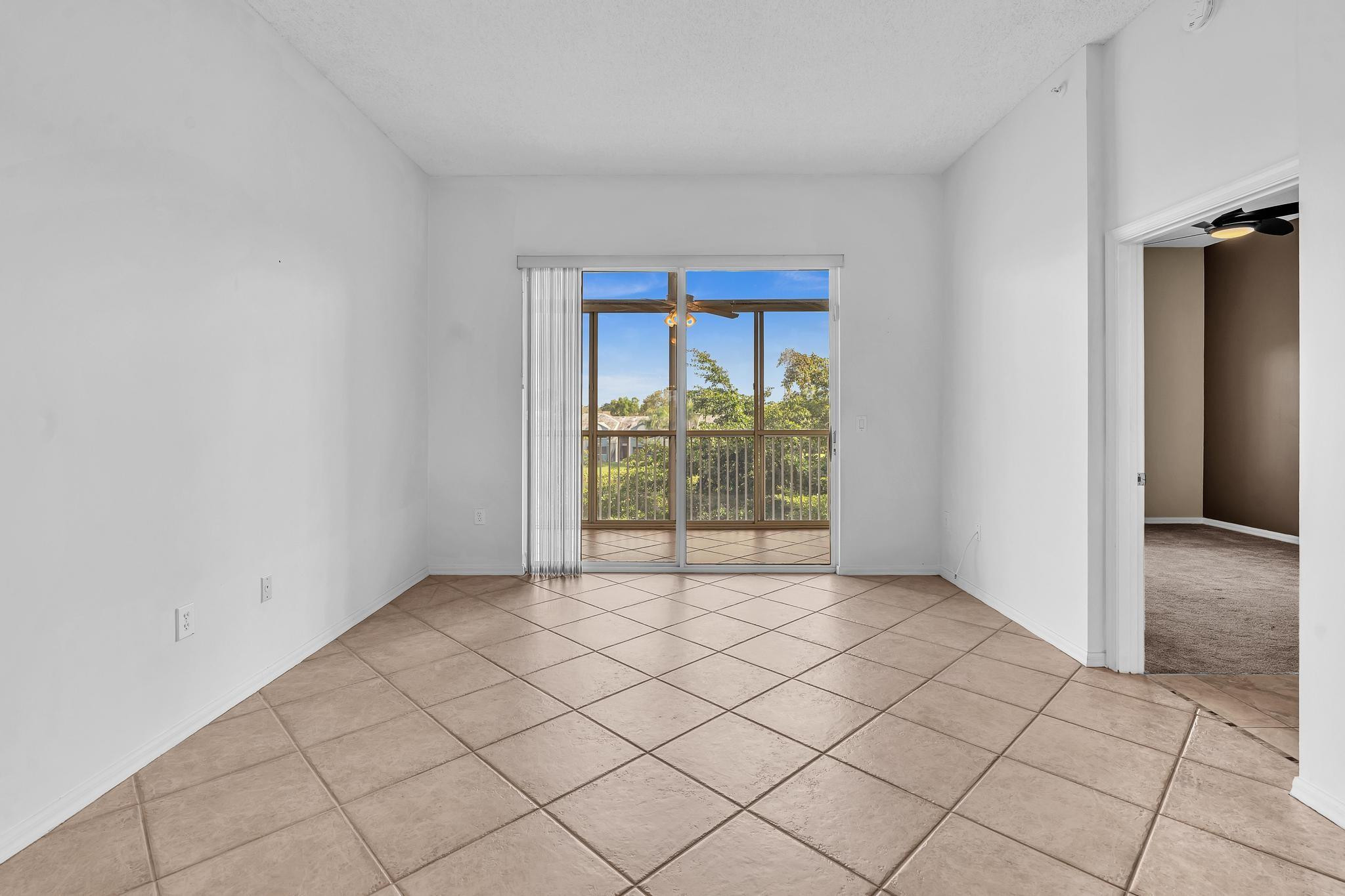 9551 Weldon Circle, Unit E411 Tamarac, FL 33321 - Photo 16 of 78 a view of an empty room and window