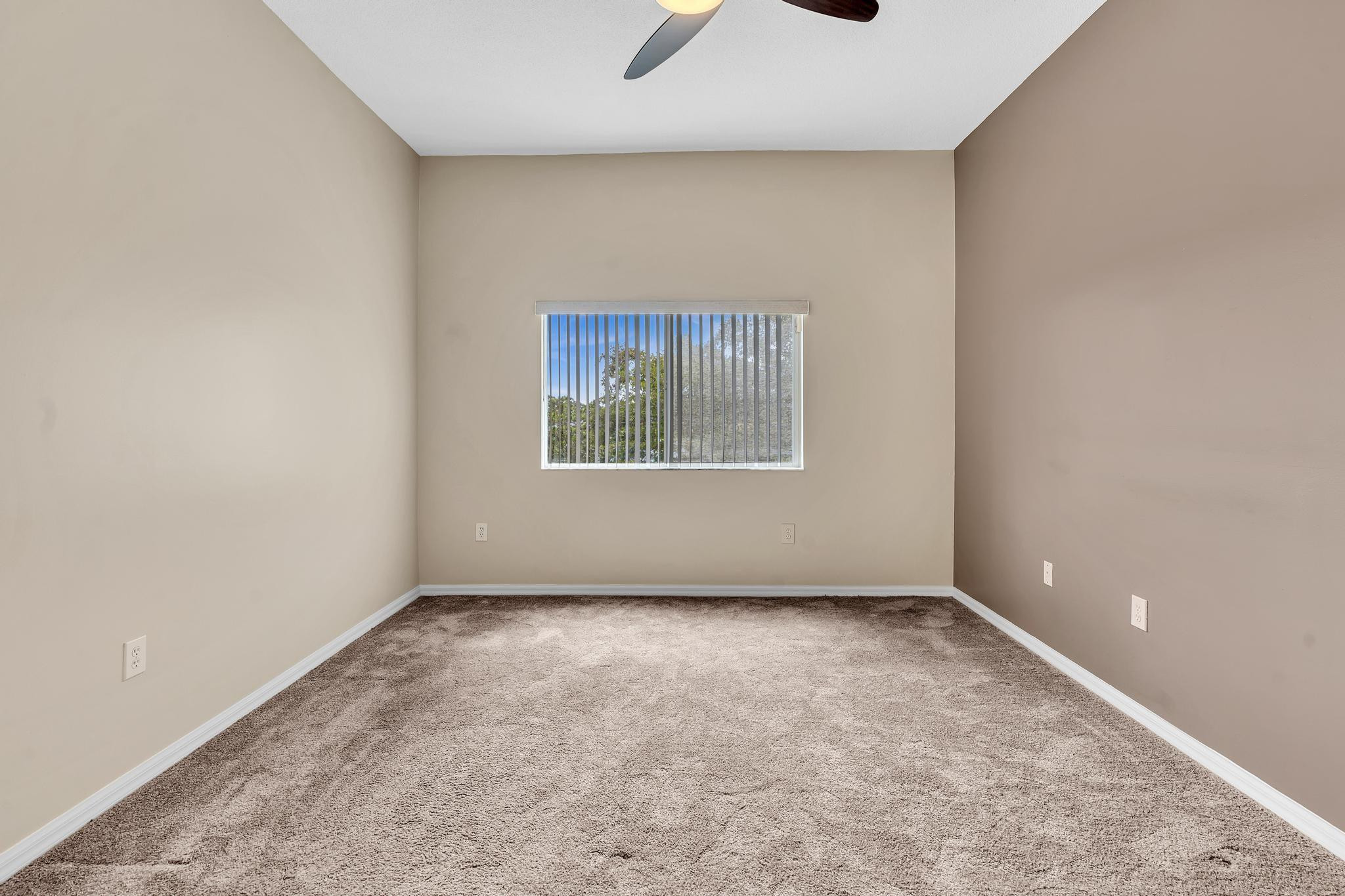 9551 Weldon Circle, Unit E411 Tamarac, FL 33321 - Photo 20 of 78 an empty room with windows