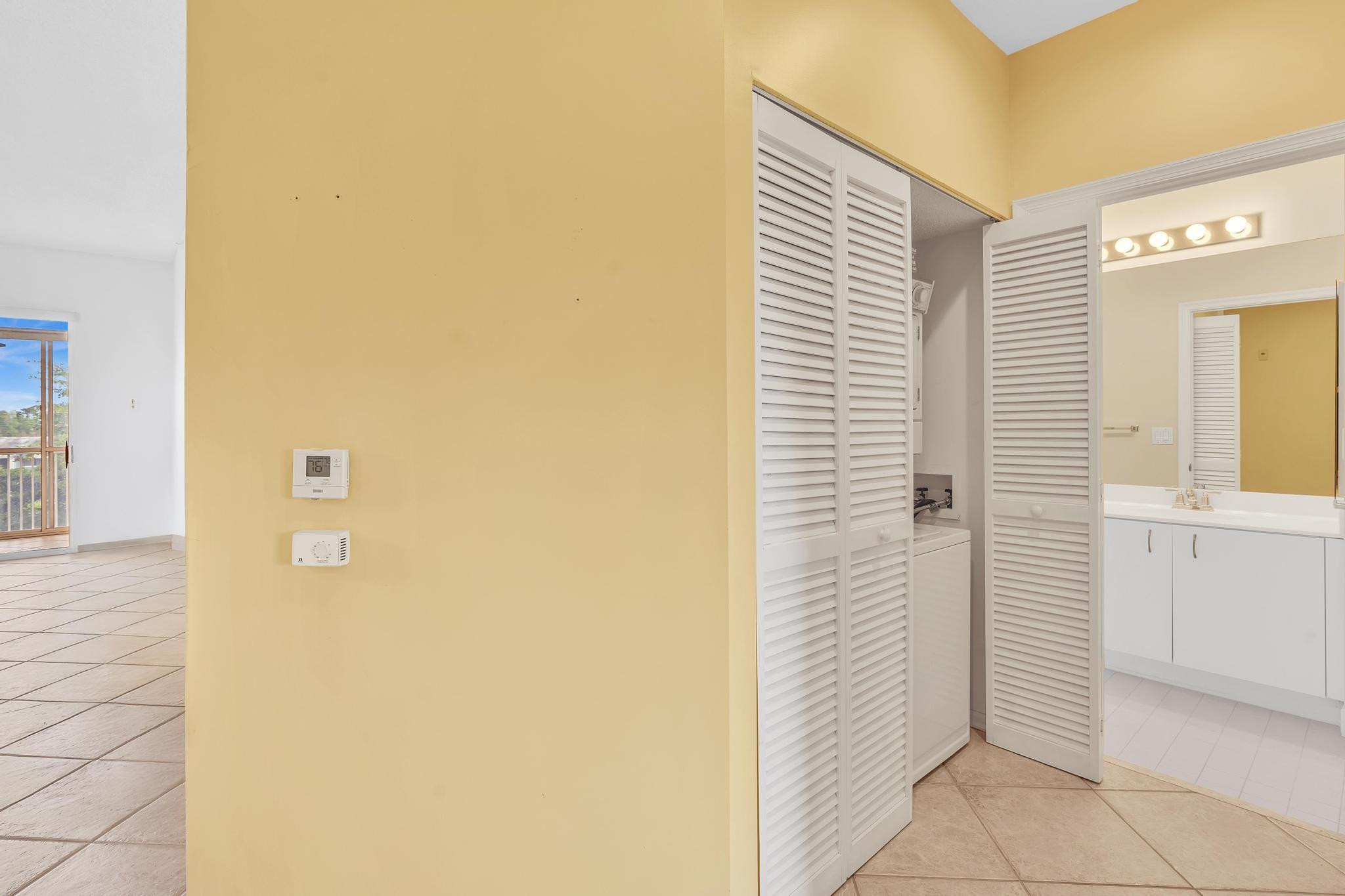 9551 Weldon Circle, Unit E411 Tamarac, FL 33321 - Photo 30 of 78 a bathroom with a shower