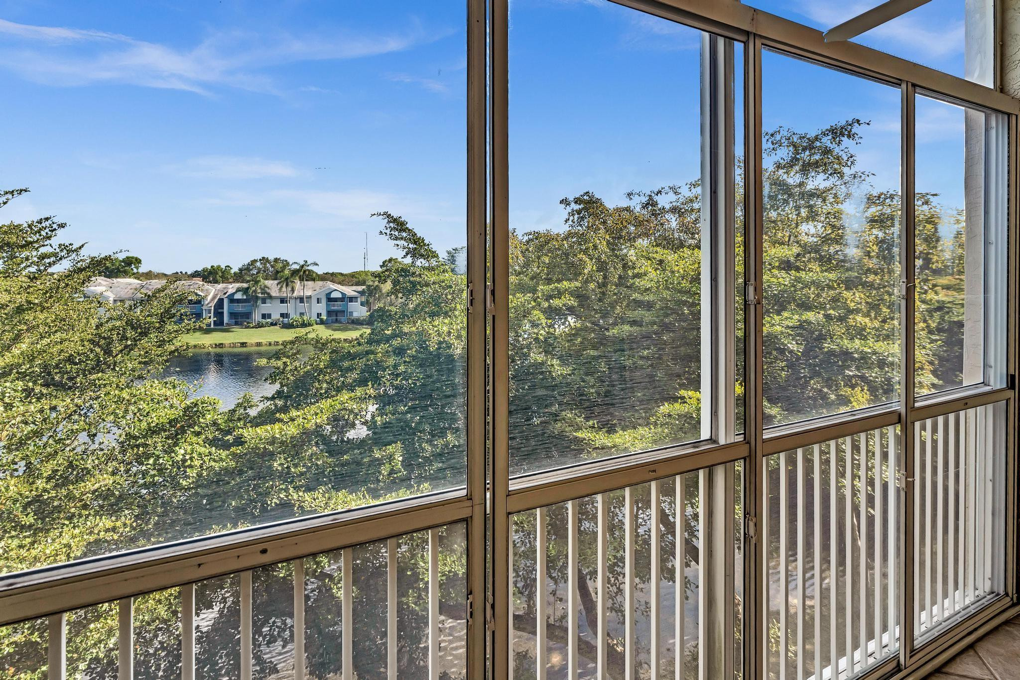 9551 Weldon Circle, Unit E411 Tamarac, FL 33321 - Photo 38 of 78 a view of a glass door with a from a chair