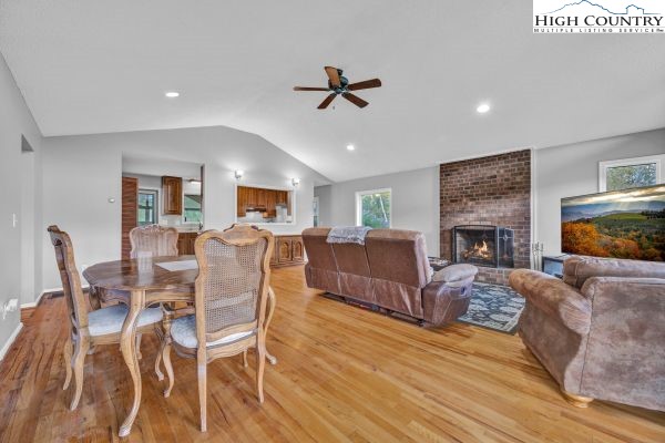 260 Smokey Road Newland, NC 28657 - Photo 11 of 43 a living room with furniture a fireplace and a flat screen tv