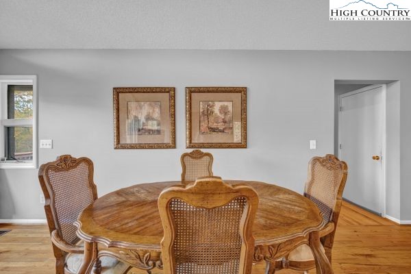 260 Smokey Road Newland, NC 28657 - Photo 12 of 43 a bedroom with a bed and wooden floor