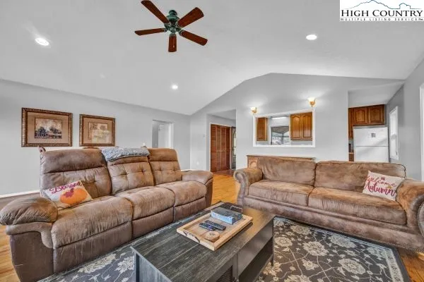 a living room with furniture and a rug