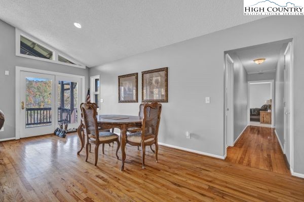 260 Smokey Road Newland, NC 28657 - Photo 19 of 43 a dining room with furniture and wooden floor