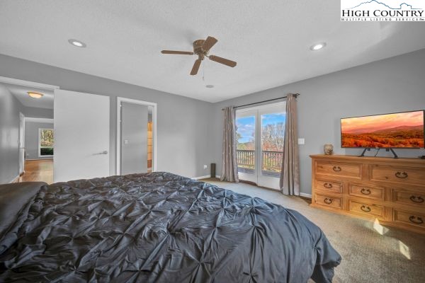 260 Smokey Road Newland, NC 28657 - Photo 23 of 43 a bedroom with a bed and a flat screen tv