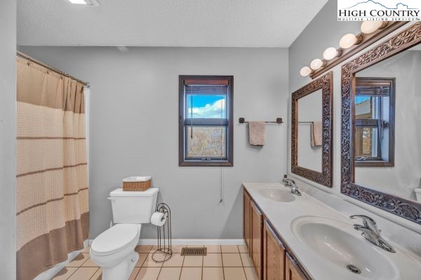 260 Smokey Road Newland, NC 28657 - Photo 25 of 43 a bathroom with a sink toilet and shower