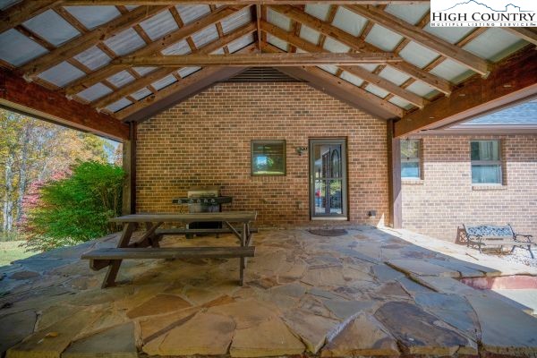 260 Smokey Road Newland, NC 28657 - Photo 31 of 43 a view of a porch with furniture and a yard