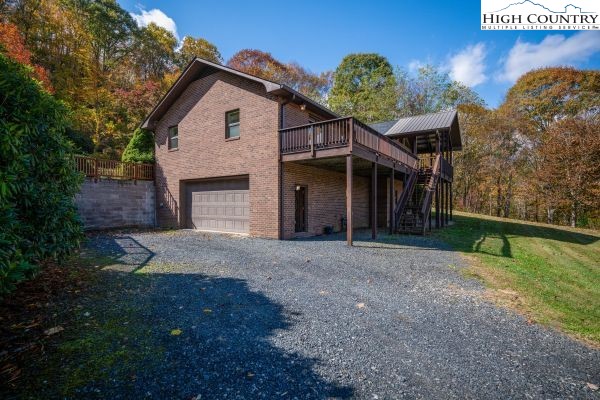 260 Smokey Road Newland, NC 28657 - Photo 33 of 43 a front view of a house with a yard and garage