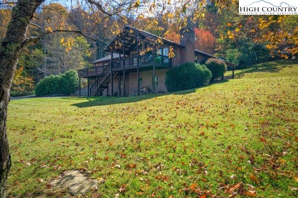 260 Smokey Road Newland, NC 28657 - Photo 36 of 43 a view of a yard with plants and large trees