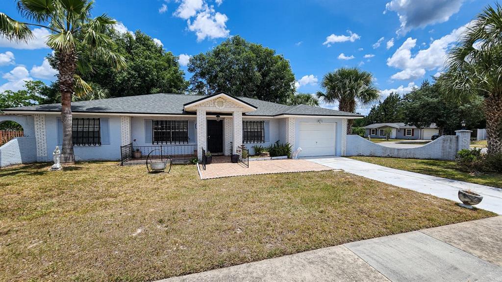 14737 Southwest 38th Terrace Road Ocala, FL 34473 - Photo 1 of 1 a white house with a large pool and yard
