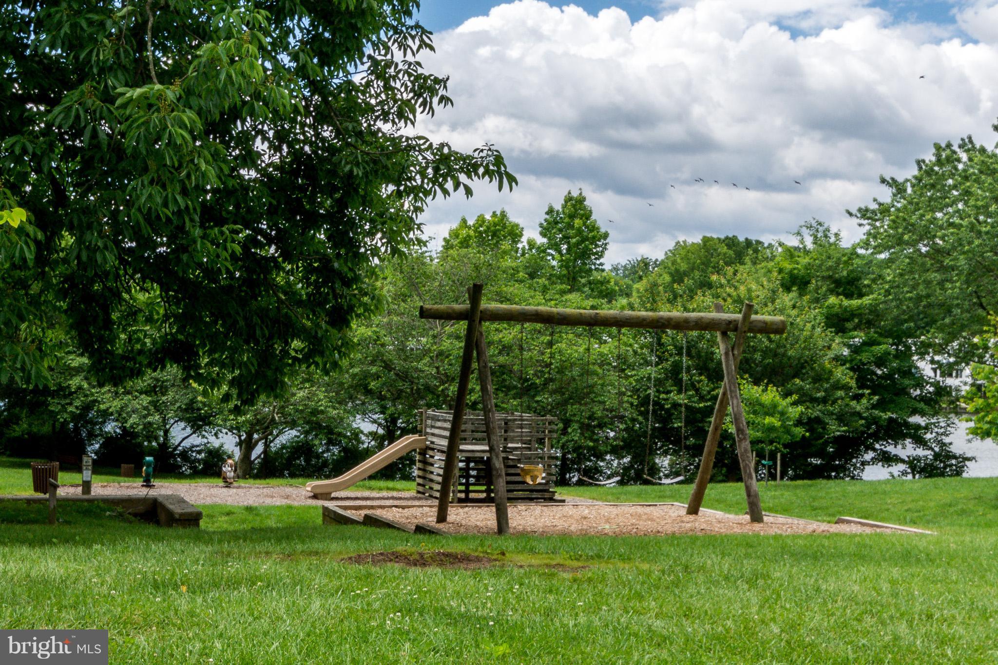5236 West Running Brook Road, Unit 302 Columbia, MD 21044 - Photo 24 of 25 a view of a park with a slide