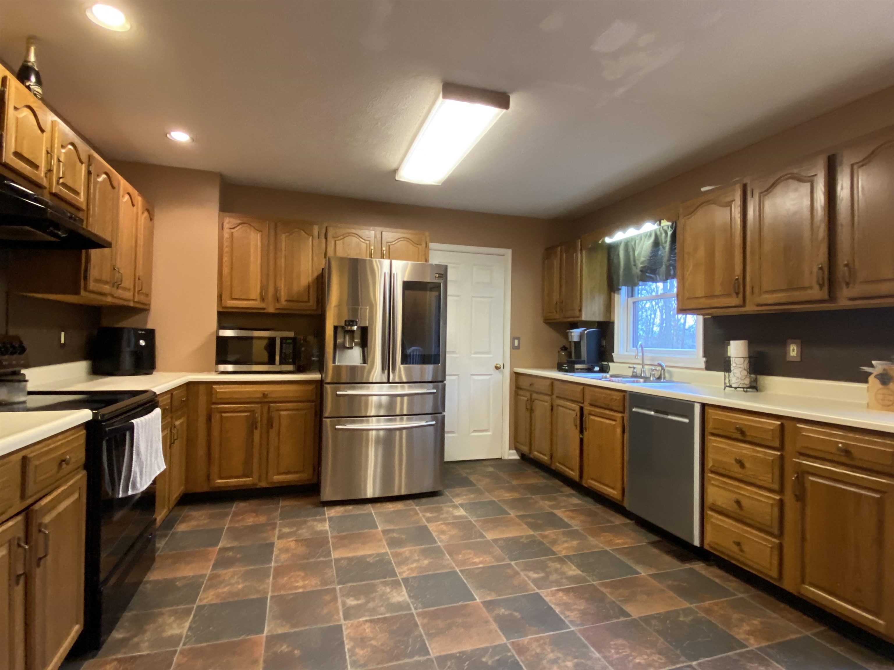 244 Chapel Road Churchville, VA 24421 - Photo 17 of 32 a kitchen with granite countertop a sink stainless steel appliances and cabinets