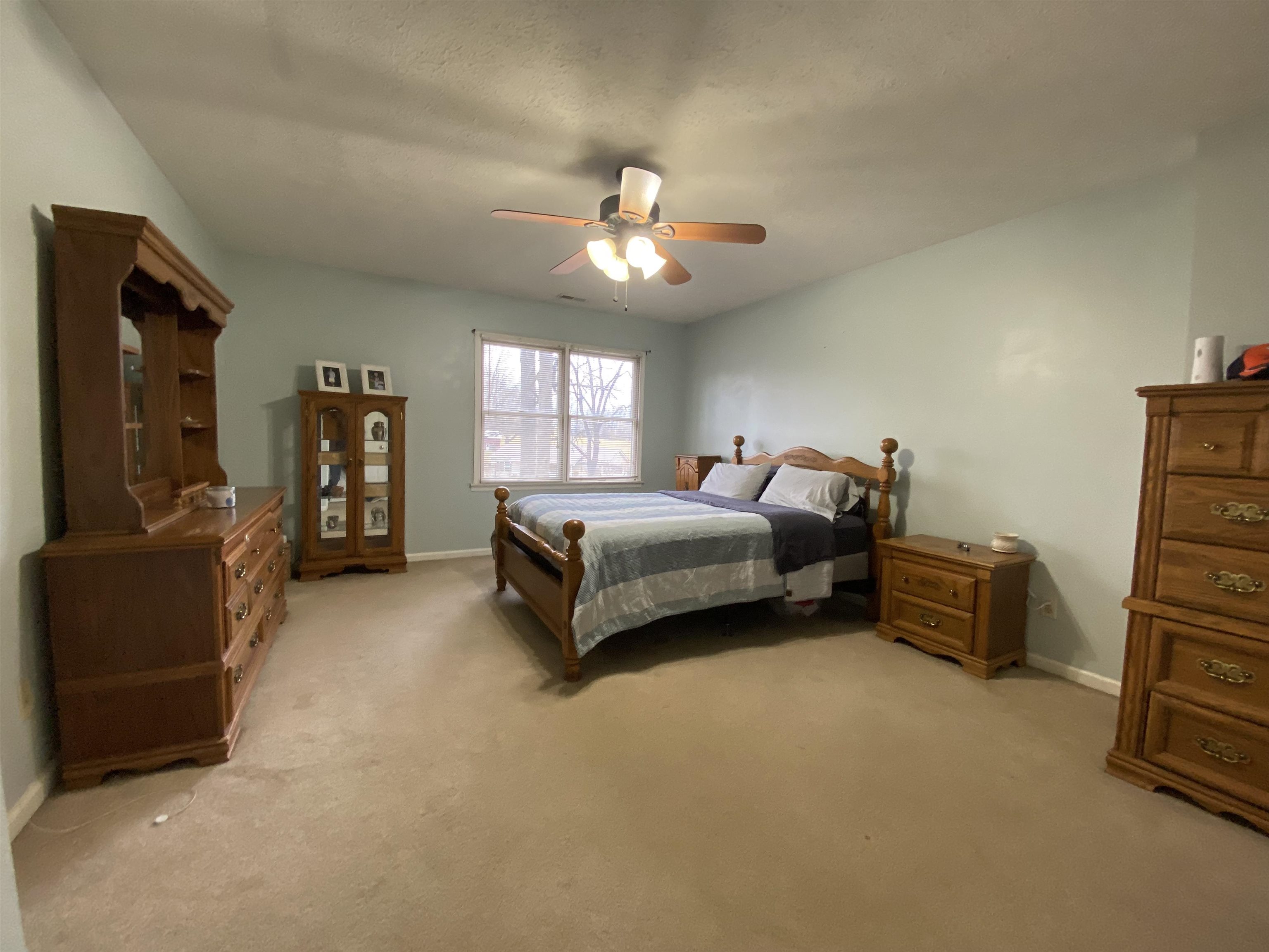 244 Chapel Road Churchville, VA 24421 - Photo 27 of 32 a spacious bedroom with a bed and furniture