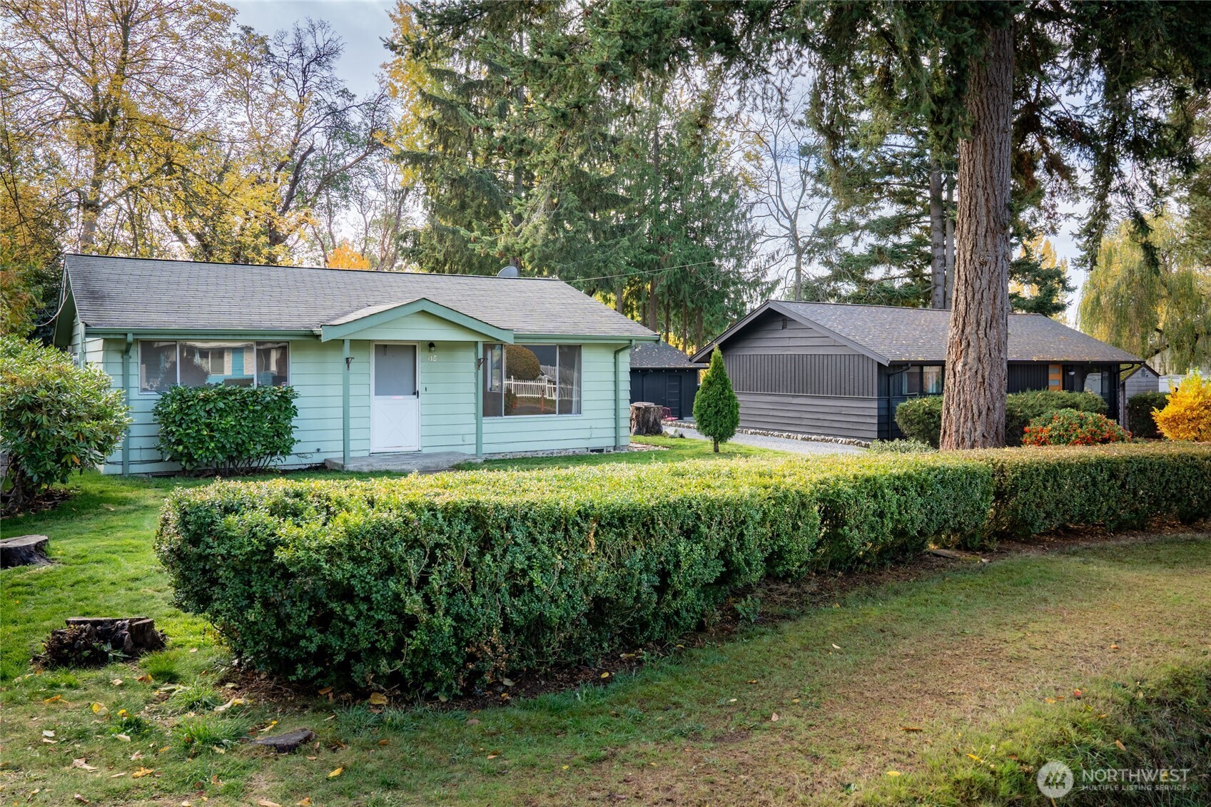 615 Southwest 124th Street Seattle, WA 98146 - Photo 1 of 24 a front view of a house with a garden