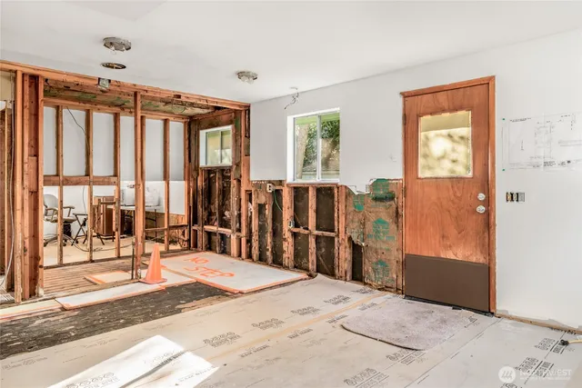 a view of a entryway with stairs and a rug