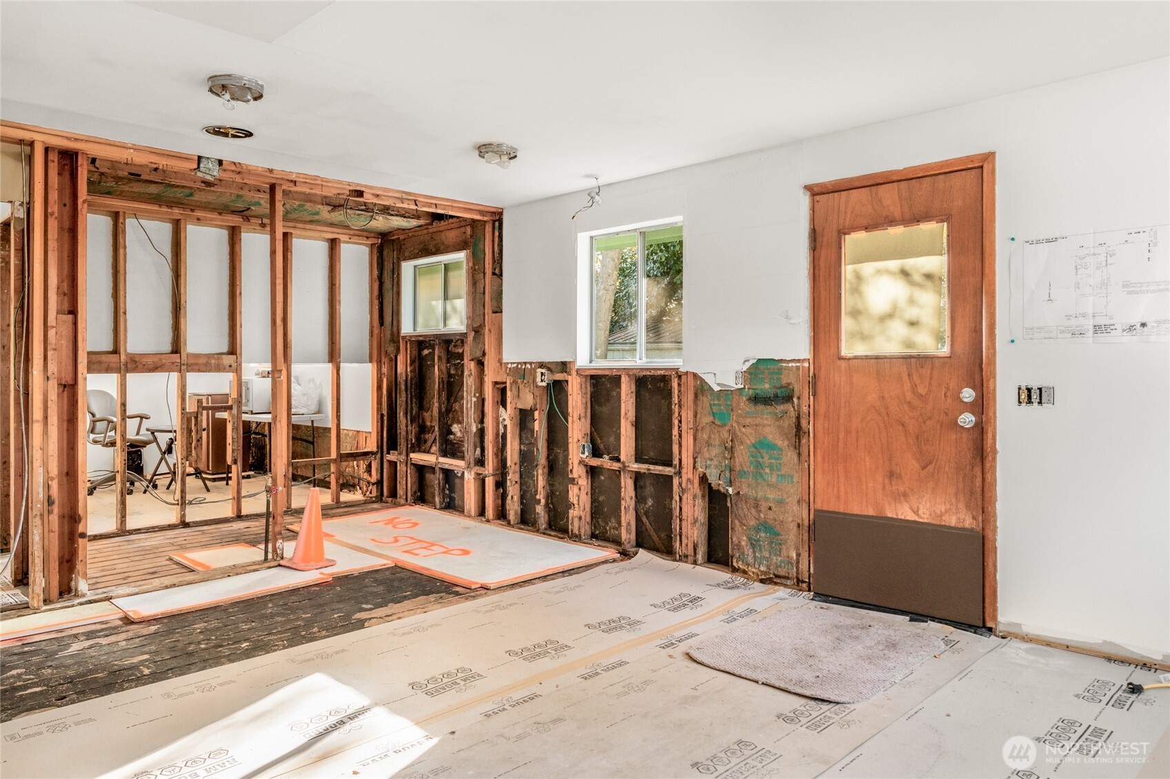 615 Southwest 124th Street Seattle, WA 98146 - Photo 16 of 24 a view of a bedroom with wooden floor and windows