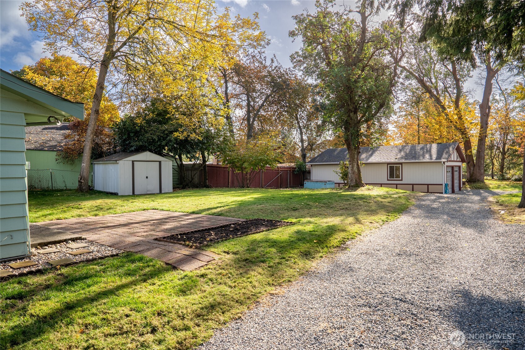 615 Southwest 124th Street Seattle, WA 98146 - Photo 3 of 24 a front view of a house with a yard