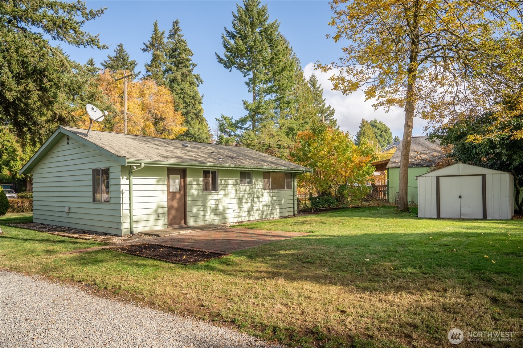 615 Southwest 124th Street Seattle, WA 98146 - Photo 4 of 24 a front view of a house with a garden and trees