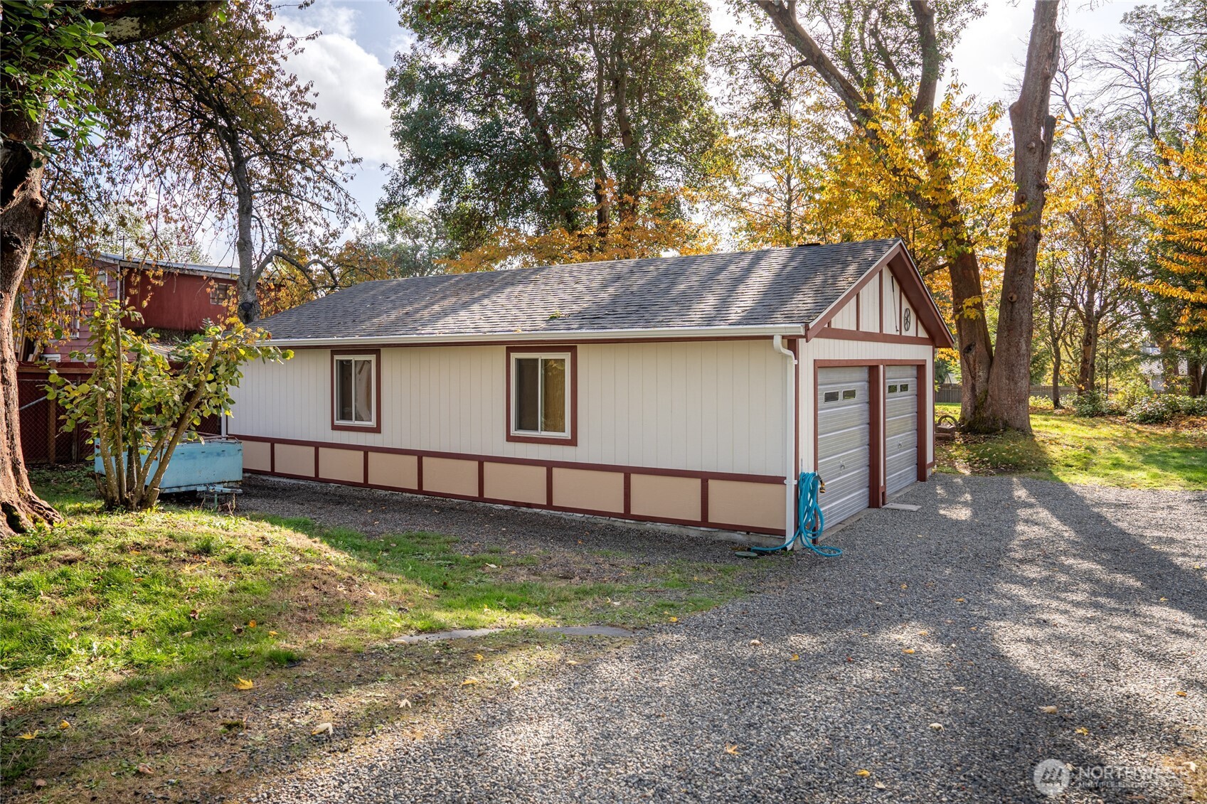 615 Southwest 124th Street Seattle, WA 98146 - Photo 5 of 24 a white house that has a tree in front of it