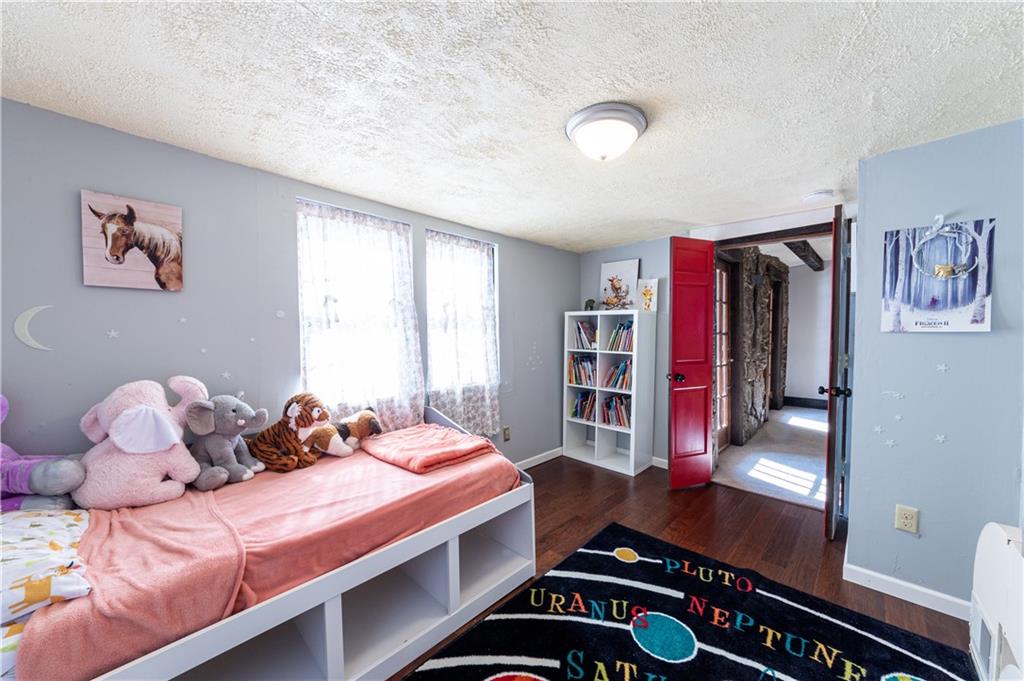 369 Mill Dam Road Cheswick, PA 15024 - Photo 17 of 25 a bedroom with a bed and a window