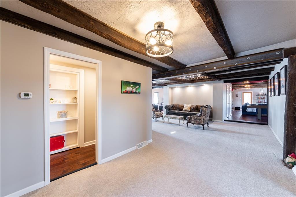 369 Mill Dam Road Cheswick, PA 15024 - Photo 20 of 25 a view of a livingroom with furniture and a ceiling fan