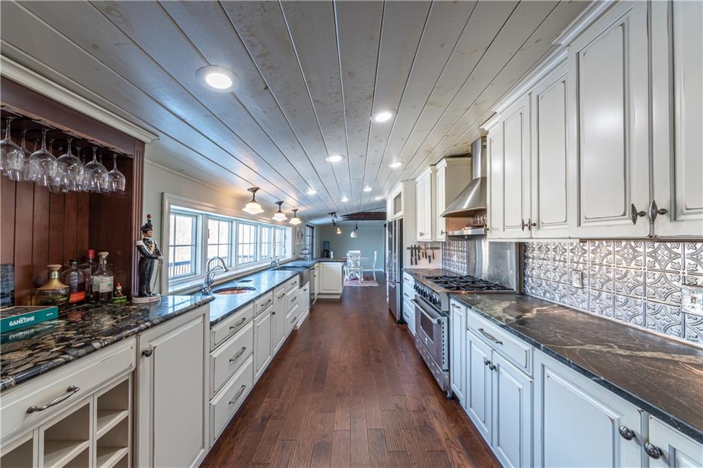 369 Mill Dam Road Cheswick, PA 15024 - Photo 4 of 25 a large kitchen with stainless steel appliances granite countertop lots of counter space and a sink