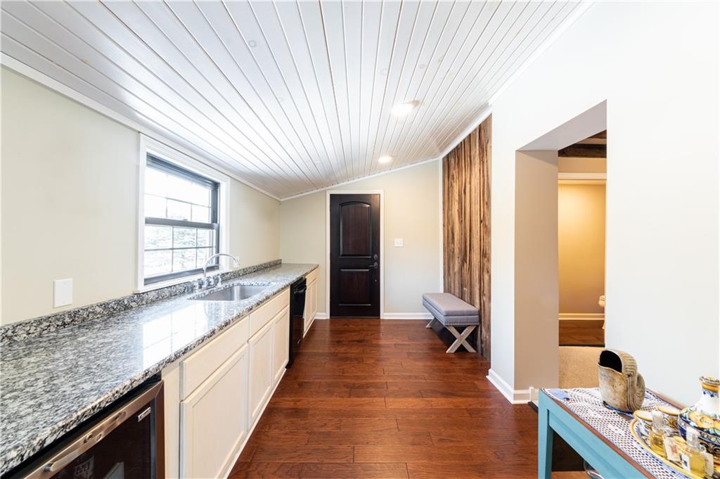 369 Mill Dam Road Cheswick, PA 15024 - Photo 6 of 25 a large kitchen with kitchen island granite countertop a large counter top a sink stainless steel appliances and cabinets