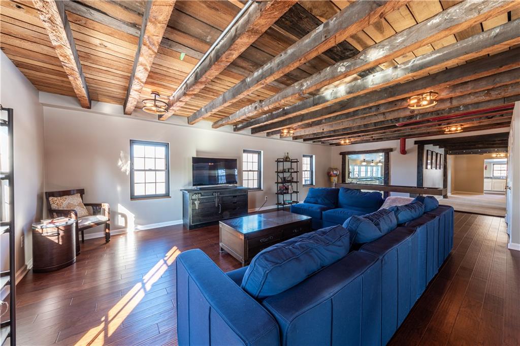 369 Mill Dam Road Cheswick, PA 15024 - Photo 7 of 25 a living room with furniture and a chandelier